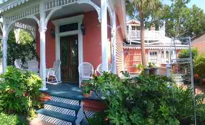 Pensacola:-Seville-Historic-District:-433-East-Zaragoza-Street_13.jpg:  victorian cottage, victorian house, victorian porch, widows walk, wicker furniture, laticework, palm tree, pecan tree