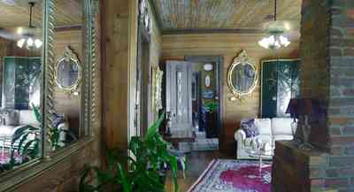 Pensacola:-Seville-Historic-District:-433-East-Zaragoza-Street_32a.jpg:  mirrors, oriental rug, fireplace, wainscotting