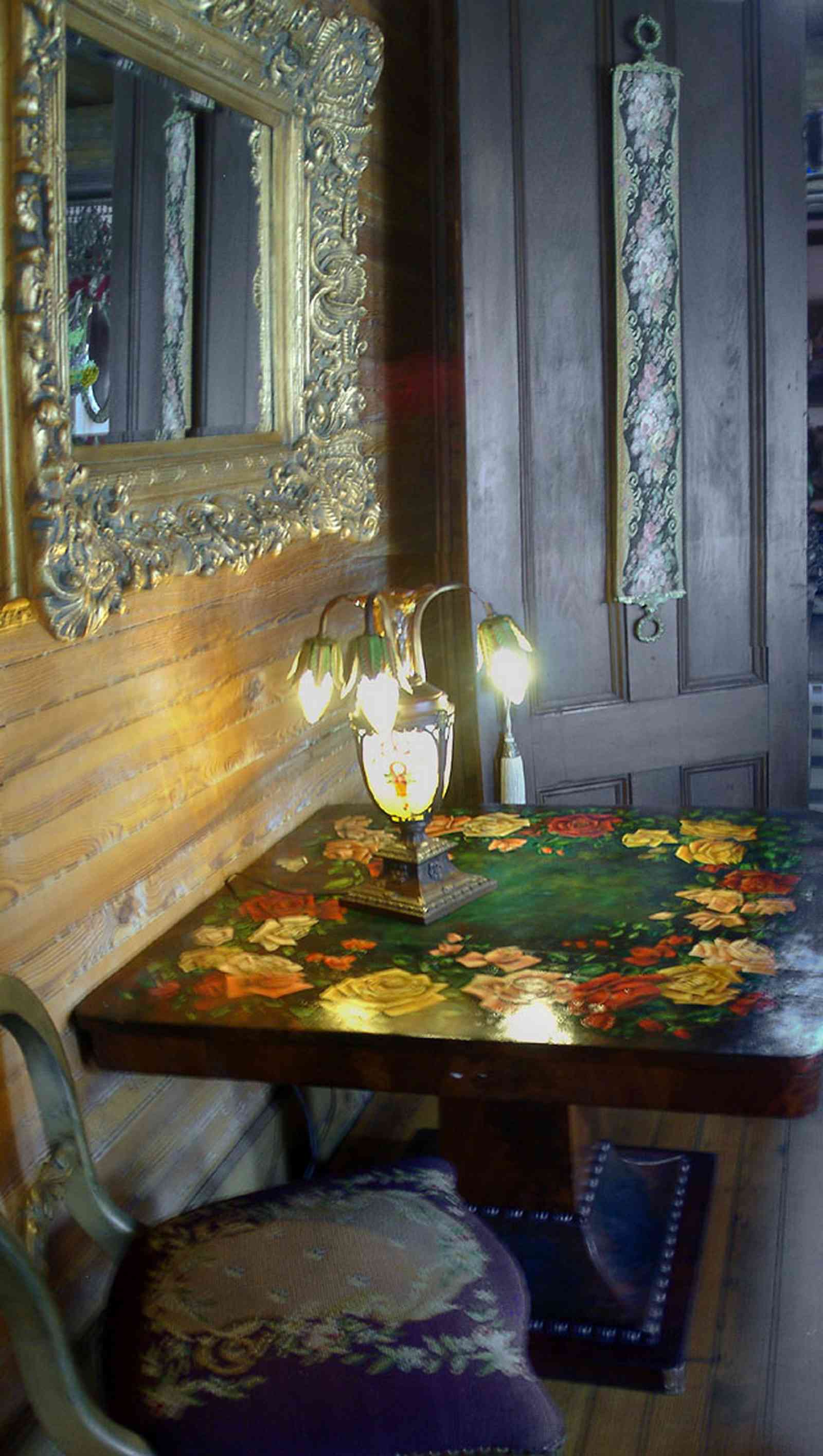 Pensacola:-Seville-Historic-District:-433-East-Zaragoza-Street_33.jpg:  roses, rococco mirror, tiffany lamp, tapestry chair, victorian house