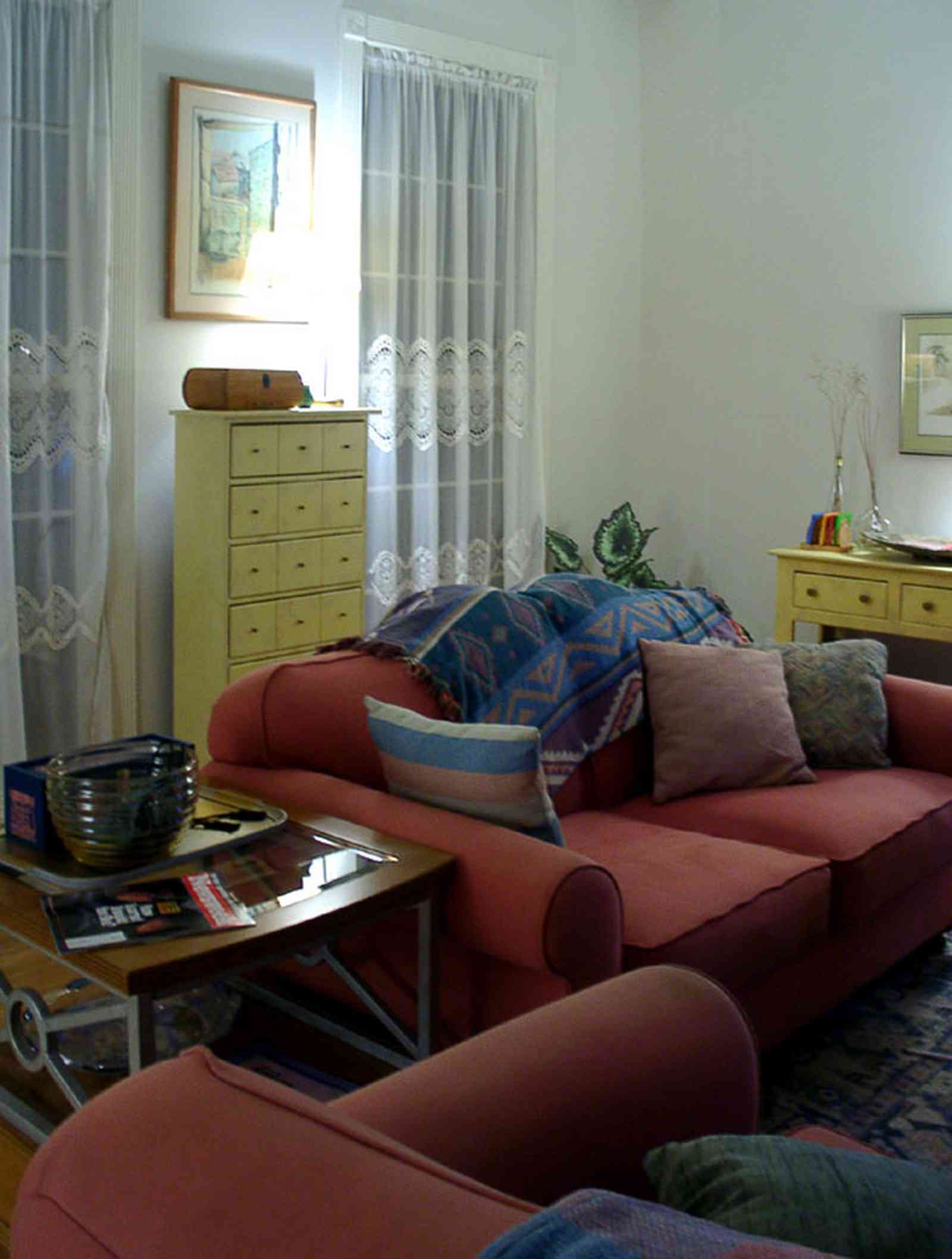 Pensacola:-Seville-Historic-District:-529-East-Government-Street_12.jpg:  sofa, lace window panel, victorian shotgun house