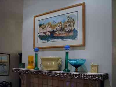 Pensacola:-Seville-Historic-District:-529-East-Government-Street_14.jpg:  mantel, fireplace, ceramic sculture, living room, oil painting