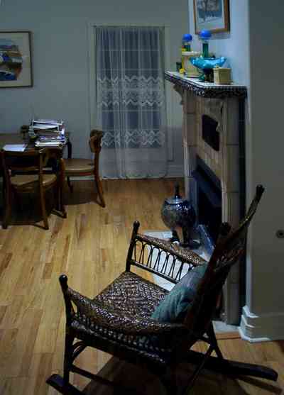 Pensacola:-Seville-Historic-District:-529-East-Government-Street_15.jpg Pensacola:-Seville-Historic-District:-529-East-Government-Street_15.jpg: rocking chair, fireplace, ceramic sculpture, lace panel curtain vase,