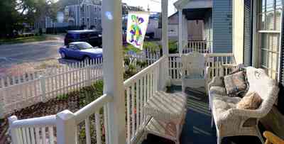 Pensacola:-Seville-Historic-District:-Chloe-And-Sophies-Attic_04.jpg:  victorian house, victorian front porch, wicker furniture, historic district