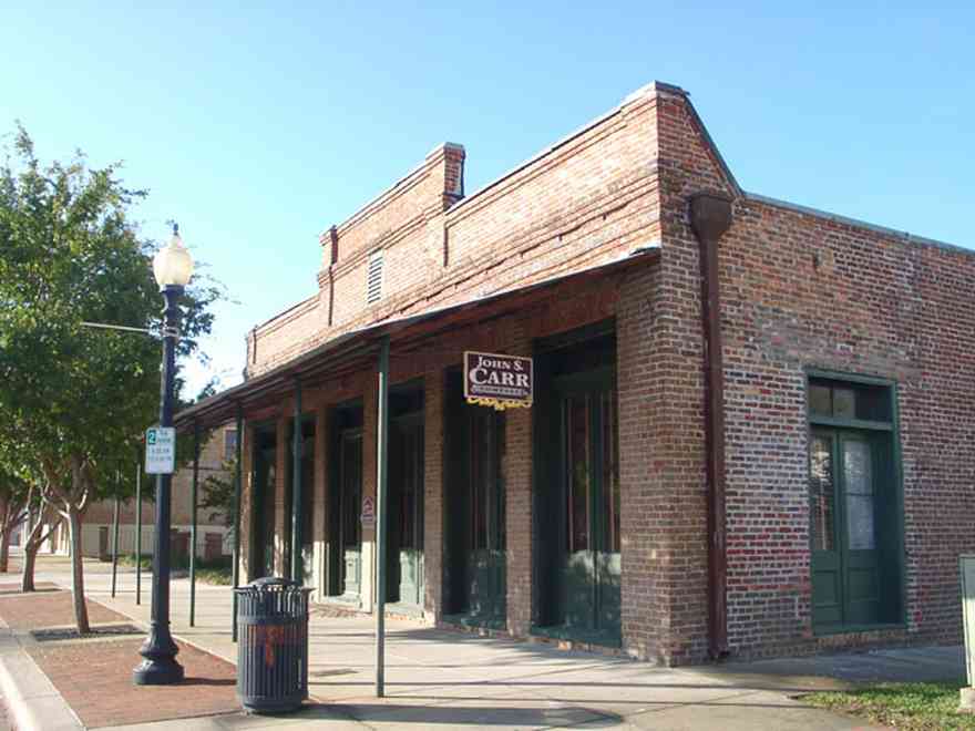 Pensacola:-Seville-Historic-District:-John-Carr-Company_01.jpg:  storefront building, real estate developer, brick building, brick sidewalk