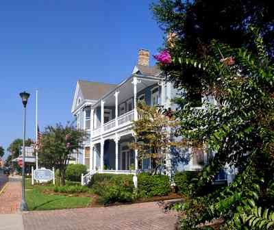 Pensacola:-Seville-Historic-District:-Kerrigan,-Estees,-Rankin,-McLeod-Law-Offices_02.jpg:  crepe myrtle tree, victorian house, gallery, porch, balcony