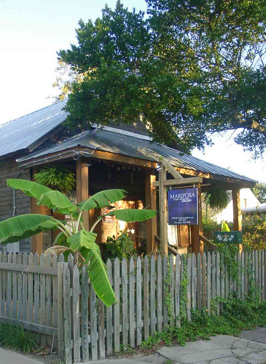 Pensacola:-Seville-Historic-District:-Mariposa-Gallery_03.jpg:  art gallery, picket fence, banana tree