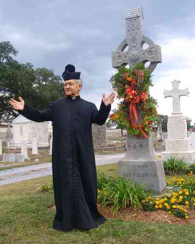 Pensacola:-Seville-Historic-District:-St-Michael-Cemetery_25.jpg:  monsienor, cross, cemetery, preach, bless, floral wreath