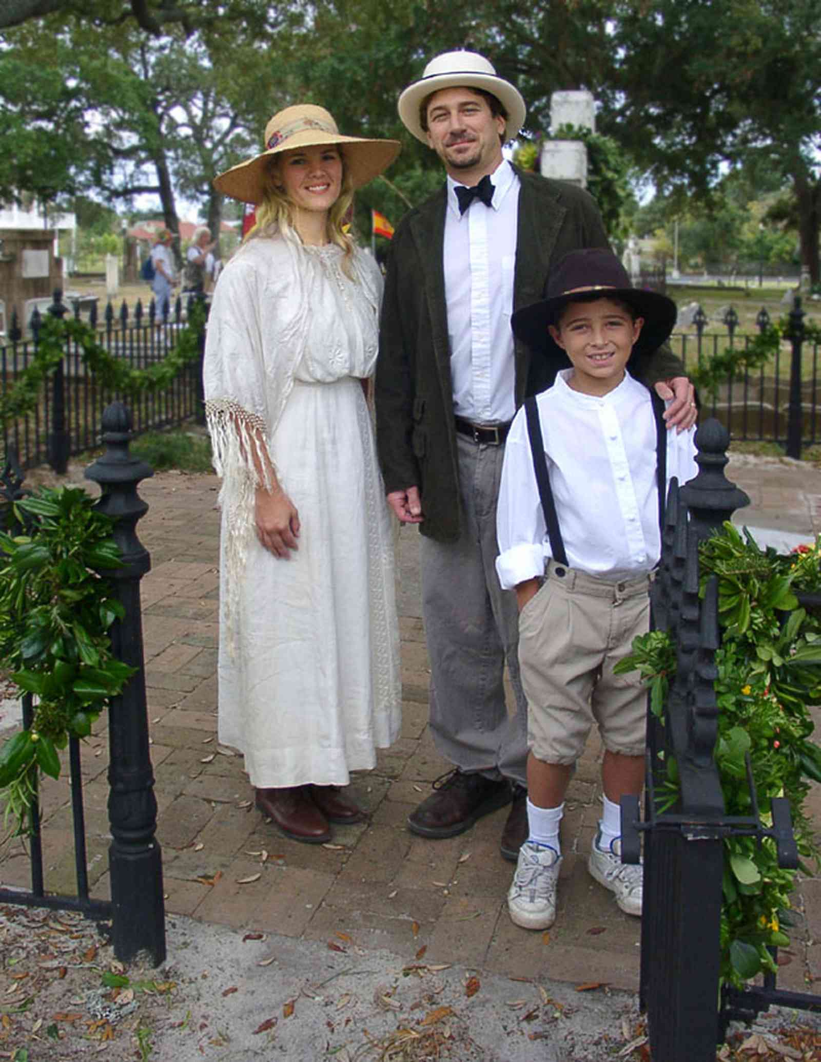 Pensacola:-Seville-Historic-District:-St-Michael-Cemetery_27.jpg:  wrought iron fence, tomb, cemetery, costumed mourners