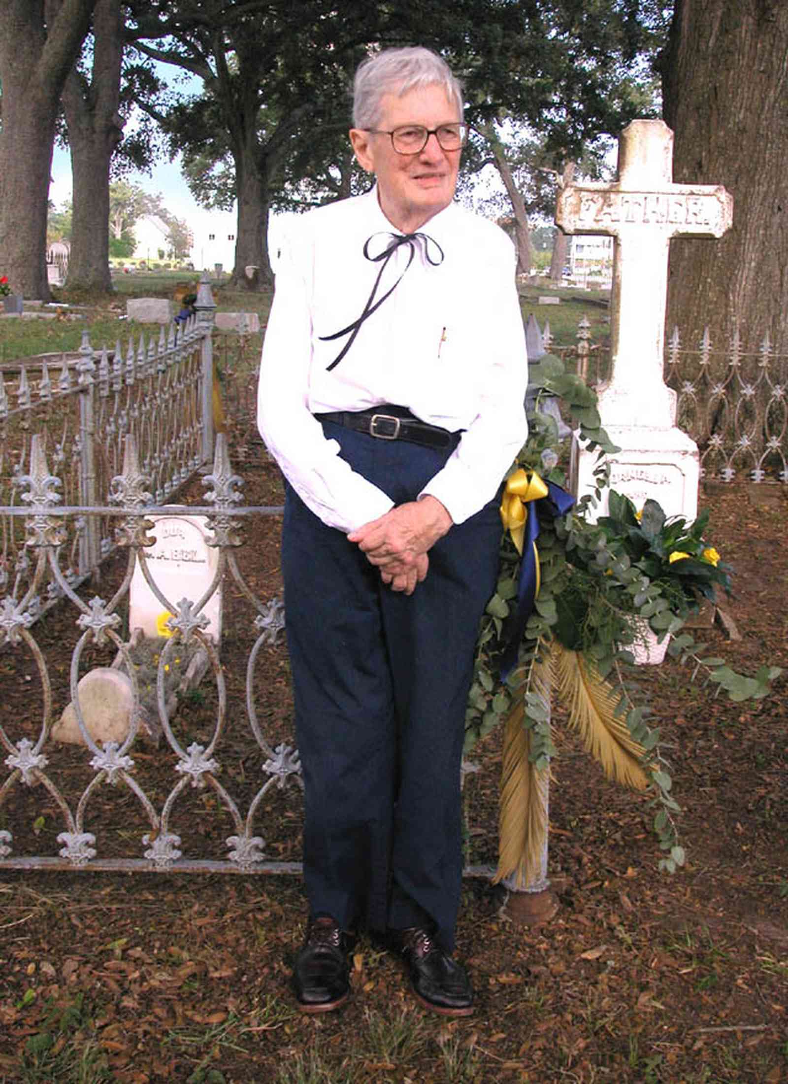 Pensacola:-Seville-Historic-District:-St-Michael-Cemetery_34.jpg:  wrought iron fence, tombstone, grave, oak trees, commemorative marker