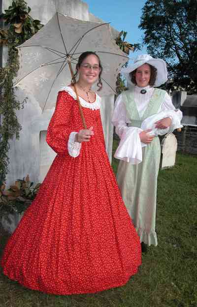 Pensacola:-Seville-Historic-District:-St-Michael-Cemetery_35.jpg:  parasol, umbrella, gravesite, baby, straw hat, tombstone
