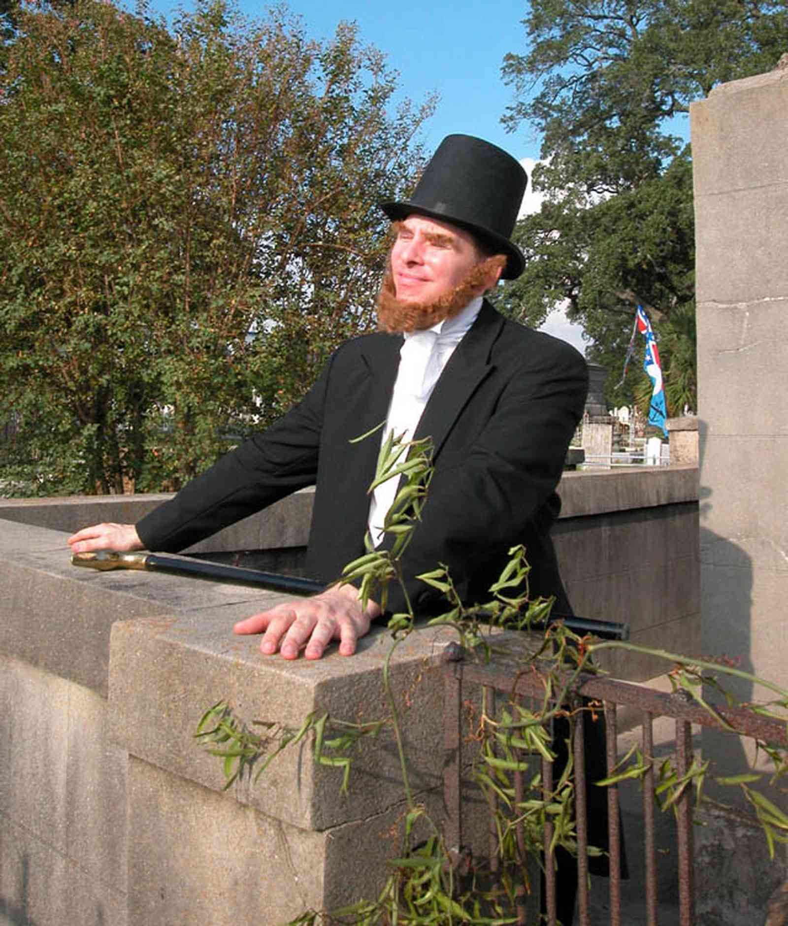Pensacola:-Seville-Historic-District:-St-Michael-Cemetery_36.jpg:  gravesite, monument, oak trees, cane, top hat