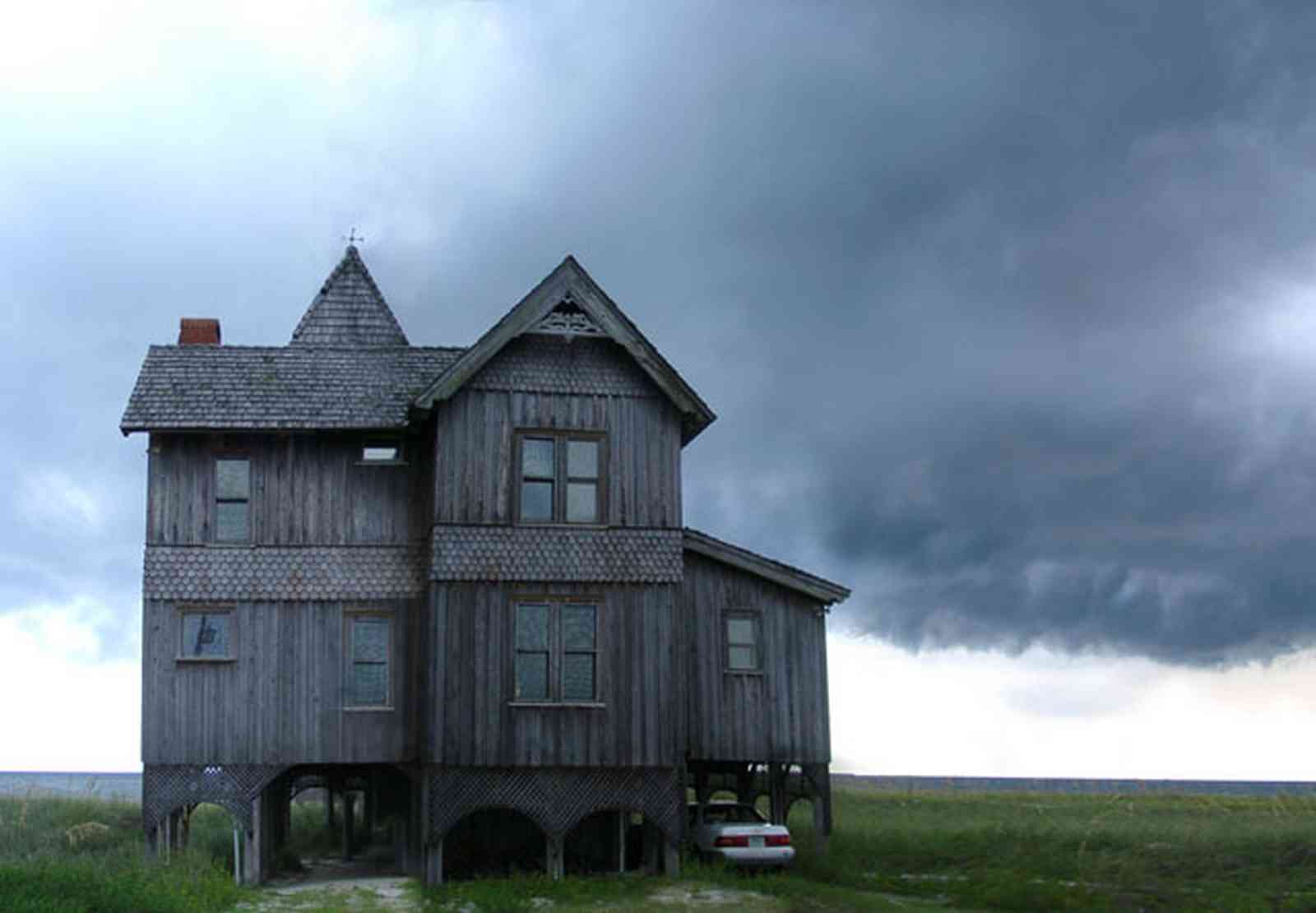 Perdido-Key:-Gothic-House_04.jpg:  gothic house, victorian house, beach, dunes, storm, gable, gingerbread trim, gulf of mexico