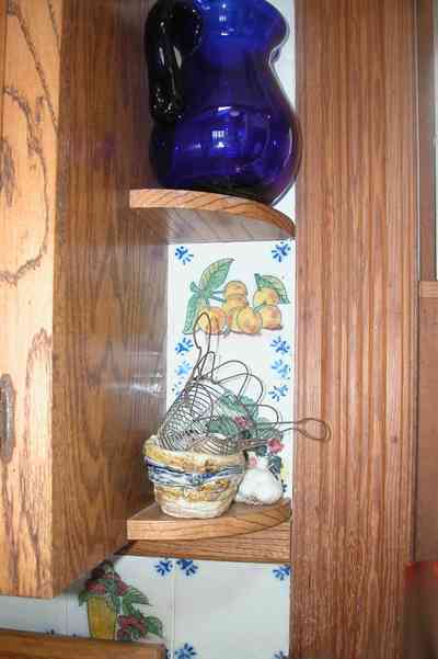 Perdido-Key:-Gothic-House_08m.jpg:  heartpine lumber, ceramic tile, kitchen, basket, woodgrain