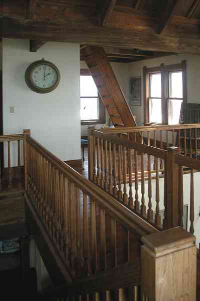 Perdido-Key:-Gothic-House_08t.jpg:  staircase, ship's clock, second floor, heartpine lumber, 