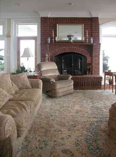 Sanders-Beach-585-Windrose_10+WEB.jpg:  living room, sofa, oriental rug, fireplace, 