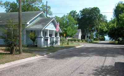 Sanders-Beach:-710-South-F-Street_03.jpg:  craftsman cottage, gulf of mexico, pensacola bay, american flag, quiet neighborhood, oak tree