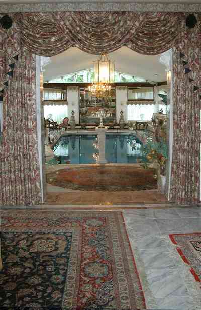 Scenic-Highway:-3780-Scenic-Ridge-Drive_03.jpg:  oriental rug, crystal chandelier, oriental rug, olympic swimming pool, marble columns, vaulted ceiling