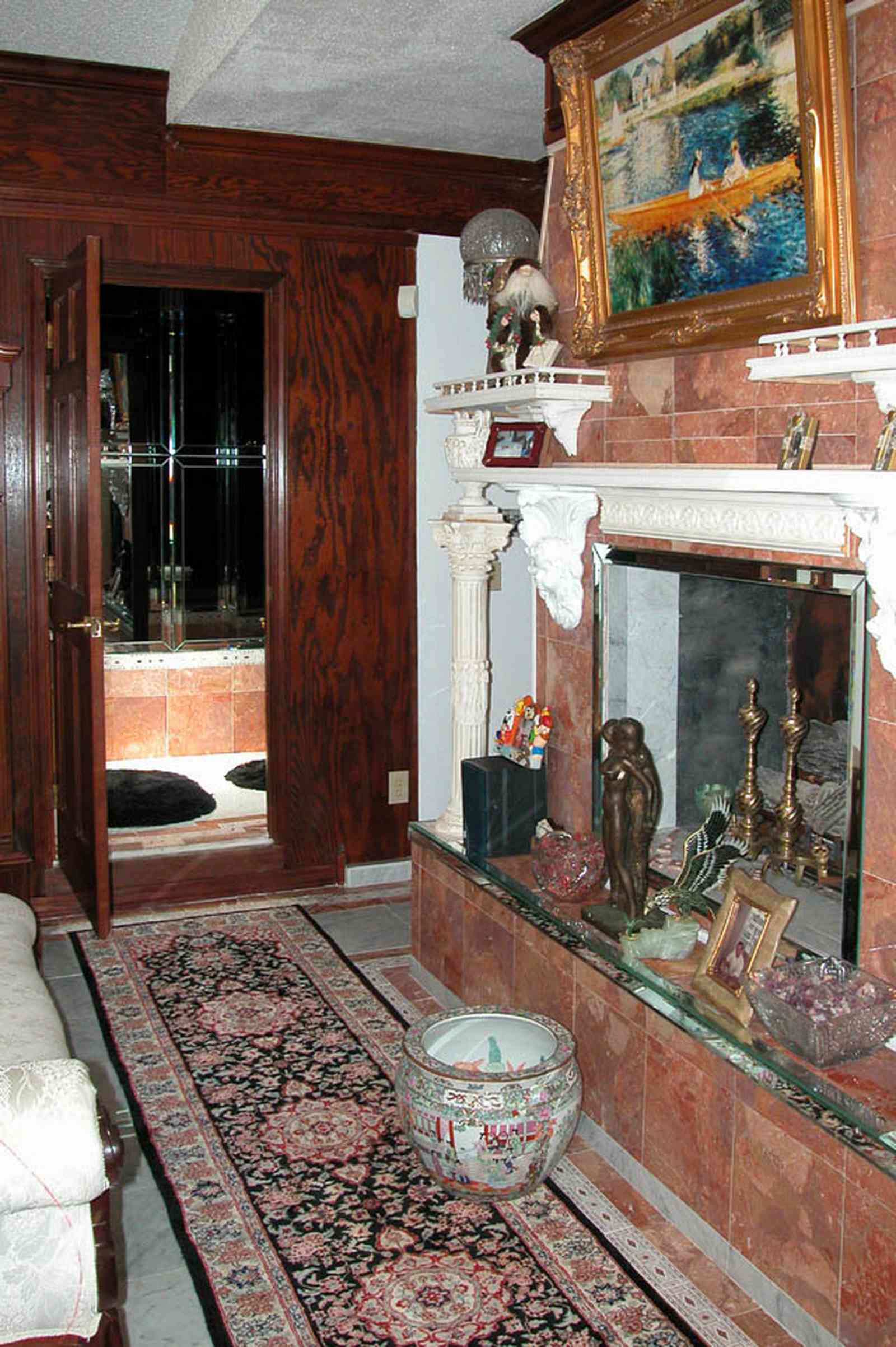 Scenic-Highway:-3780-Scenic-Ridge-Drive_07.jpg:  oriental rug, chinese vase, andirons, bathroom, sitting room, walnut paneling