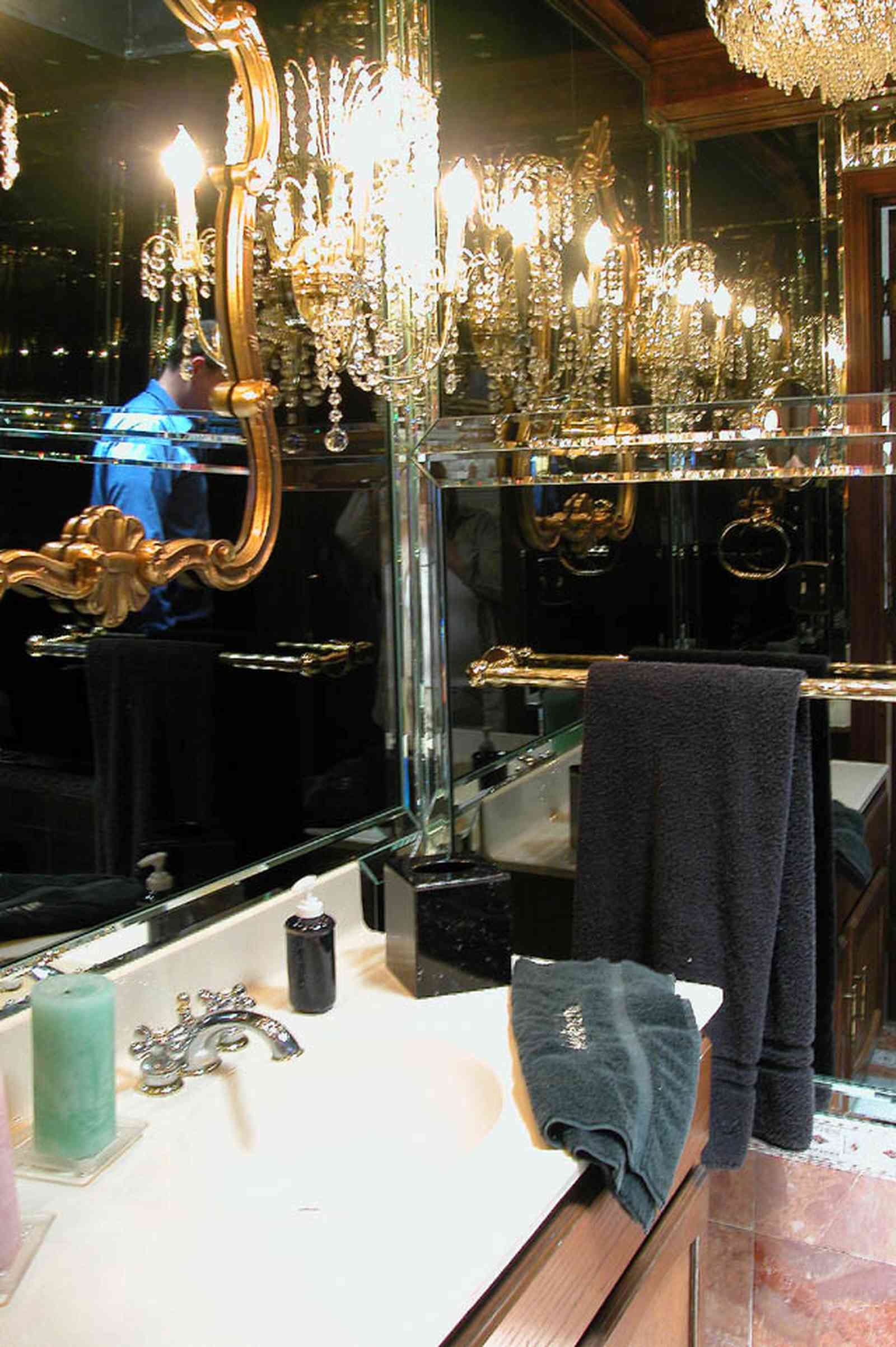 Scenic-Highway:-3780-Scenic-Ridge-Drive_08.jpg:  mirrored wall, bathroom, crystal wall sconce, towel rack, reflection, marble floor