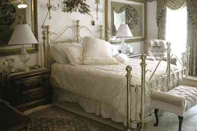 Scenic-Highway:-3780-Scenic-Ridge-Drive_09.jpg:  brass bed, battenberg lace, oriental rug, settee, swag drapes, marble floors, 