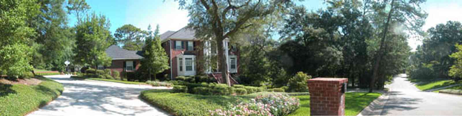 Scenic-Highway:-4220-Montalvo-Street_01.jpg:  colonial architectural style, white columns, shutters, crown molding pediment, circular driveway, mail box, perwinkles, box hedge, 