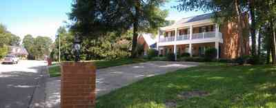 Scenic-Highway:-4540-Bohemia-Drive_02.jpg:  colonial architectural style, front porch, gable, oak tree, circular driveway, red brick