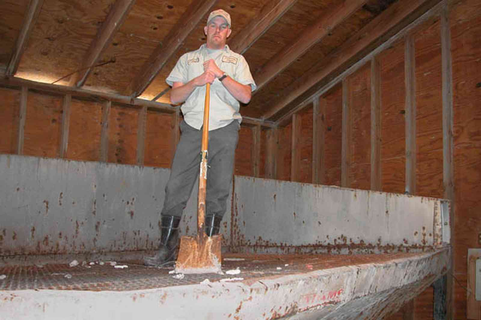 Walnut-Hill:-Escambia-Grain-Corp_11.jpg:  grain elevator, wheat, corn, soy beans, tower, loading dock, farmers, seed, shovel, fill bags, mix fertilizer, fertilizer