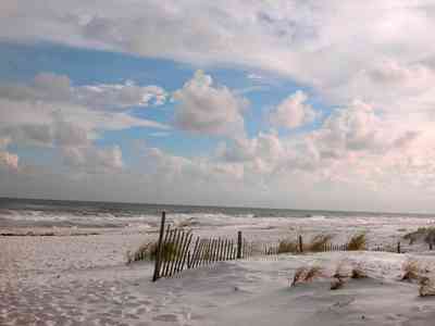 Gulf-Islands-National-Seashore:-Parking-Lot-9_04.jpg:  dune fence, gulf of mexico, mixed skies, quartz sand, surf, sea oats, barrier island
