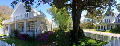 Milton:-Historic-District:-301-Pine-Street:-Butler-Potter-Schlenker-House_07.jpg:  picket fence, victorian house, magnolia tree, azalea bushes