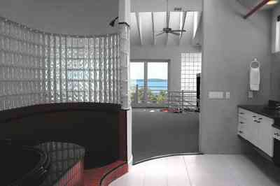 Navarre:-7332-Grand-Navarre-Blvd_51.jpg:  art deco house, bathroom, glass brick wall, skylight, black laquer cabinets