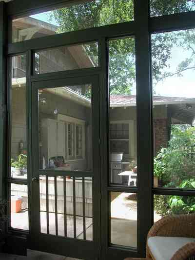 North-Hill:-284-West-Gonzales-Street_28.jpg:  screened porch, wicker chair, craftsman cottage, garage apartment