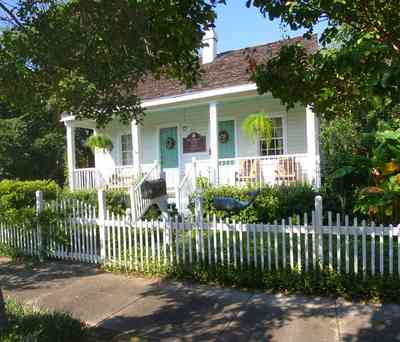 Pensacola:-Seville-Historic-District:-211-South-Florida-Blanca-Street_01.jpg:  picket fence, creole cottage, porch